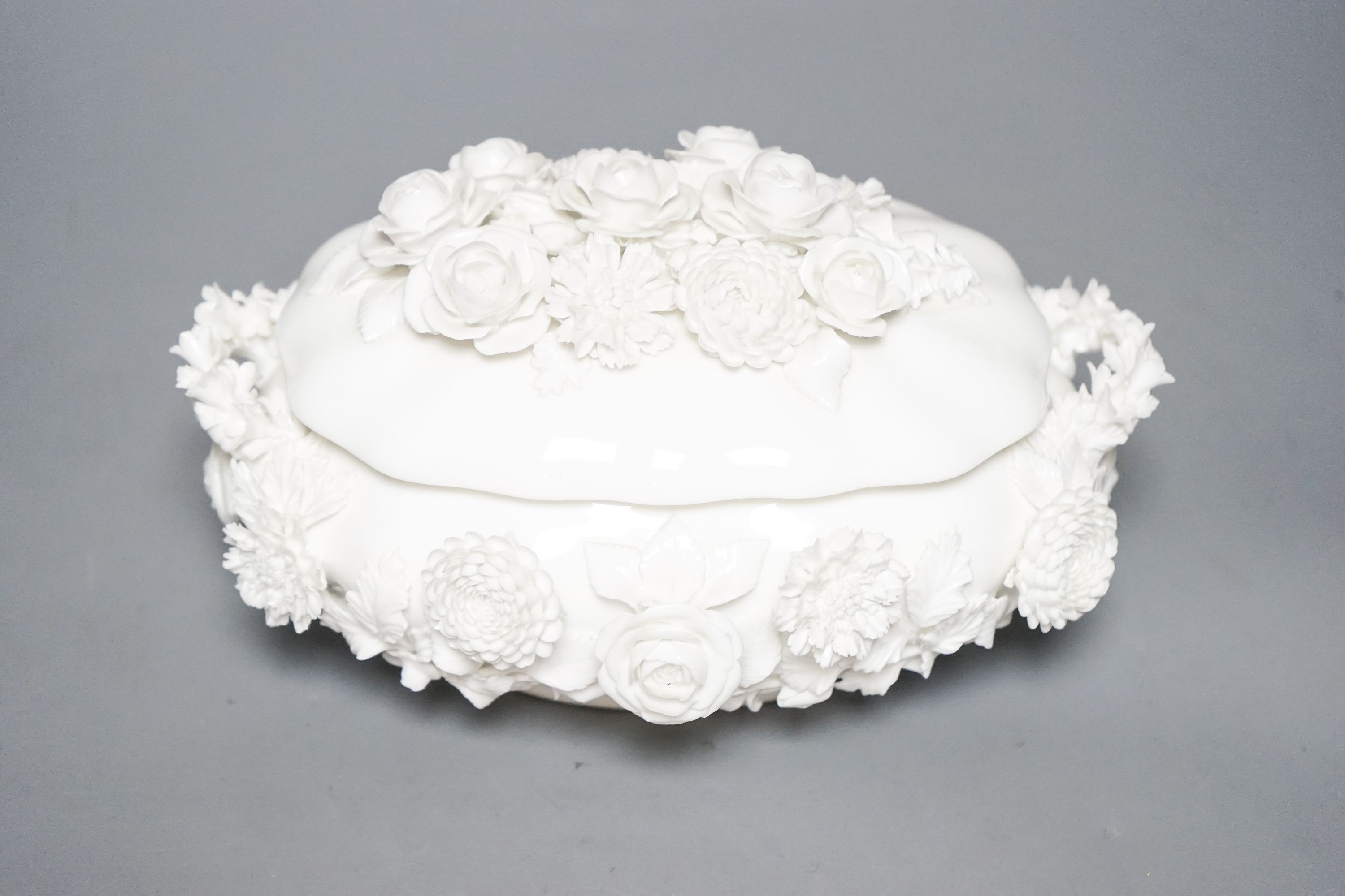 A Coalbrookdale by Coalport white glazed porcelain floral encrusted bowl and cover 23cm